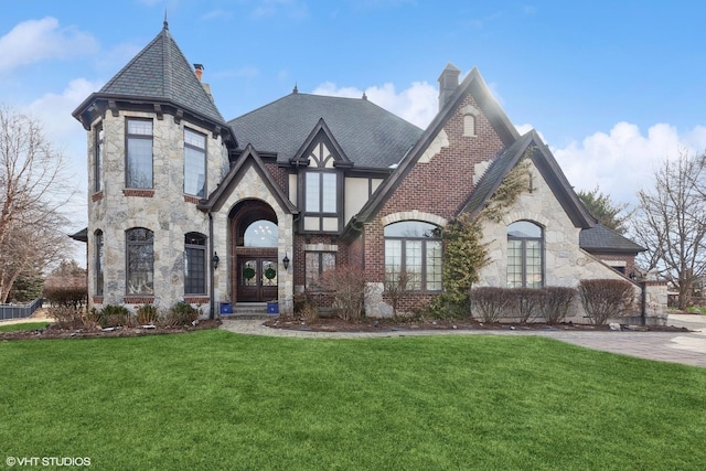 view of front of home featuring a front lawn and french doors