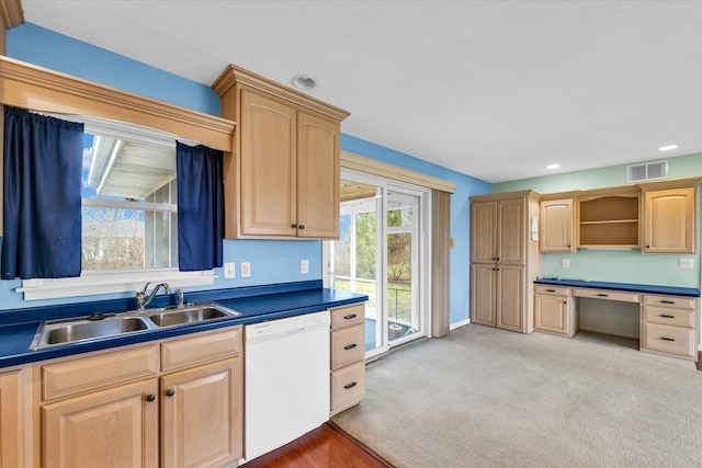 kitchen featuring light carpet, light brown cabinets, white dishwasher, and sink