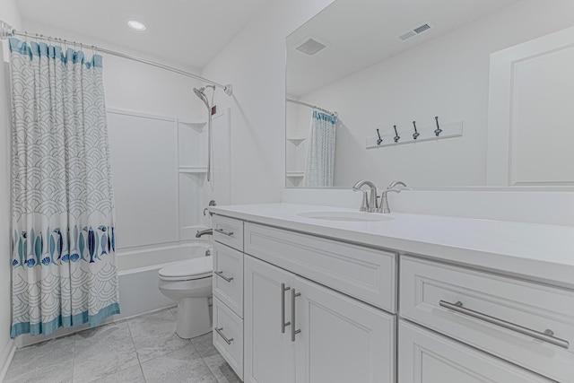 full bathroom featuring vanity, shower / bath combination with curtain, and toilet