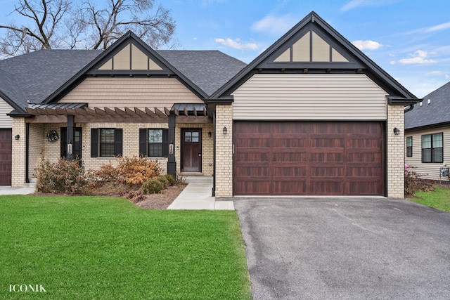 view of front facade with a garage and a front lawn