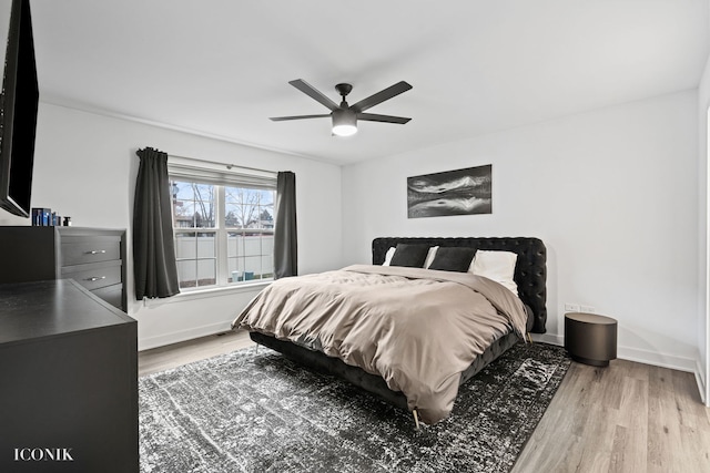 bedroom featuring light wood-type flooring and ceiling fan