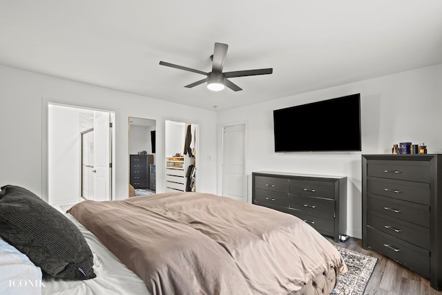 bedroom with ceiling fan and dark wood-type flooring