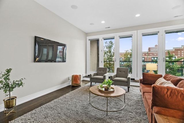 living room with dark wood-type flooring and lofted ceiling