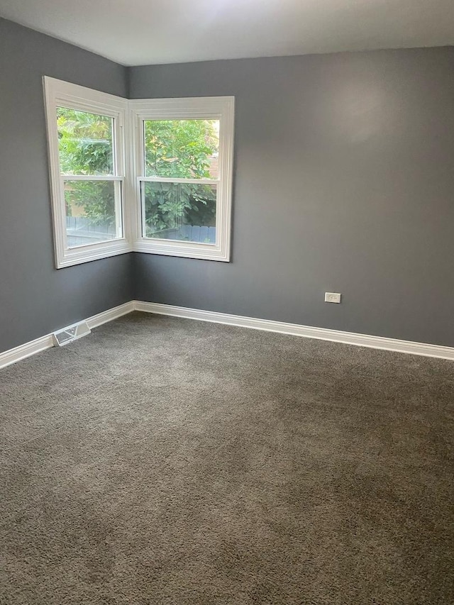 empty room with carpet flooring