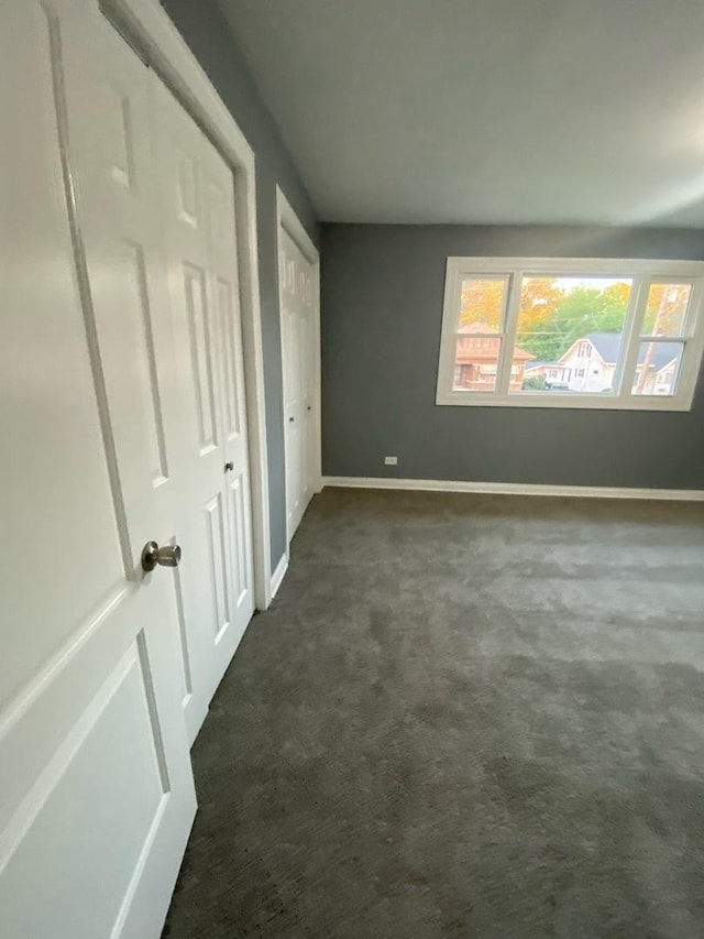 interior space with dark carpet