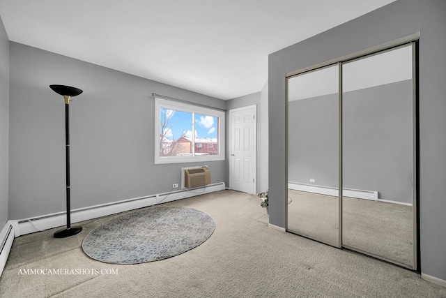 carpeted bedroom with a wall mounted air conditioner and a baseboard heating unit