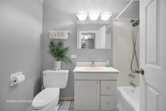 full bathroom with tile patterned flooring, vanity, toilet, and tiled shower / bath combo