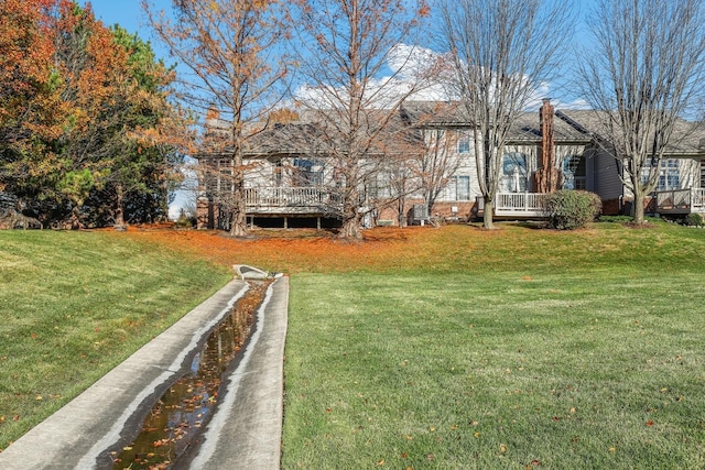 view of yard featuring a wooden deck