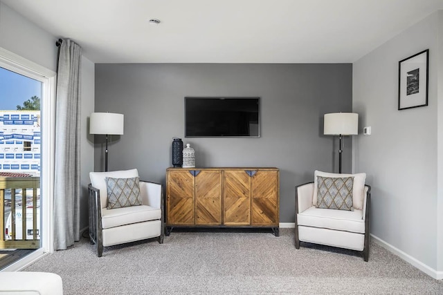 sitting room with light carpet