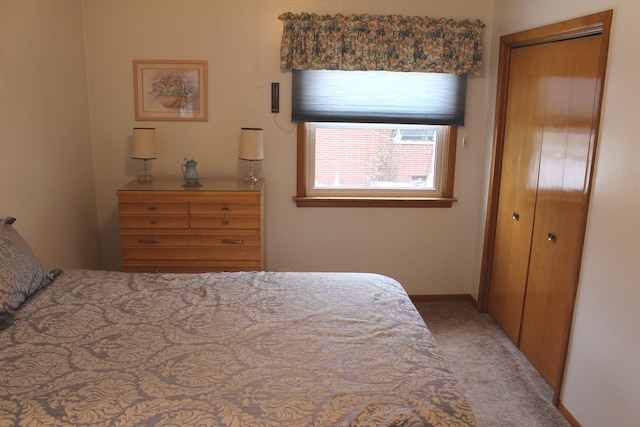 carpeted bedroom featuring a closet