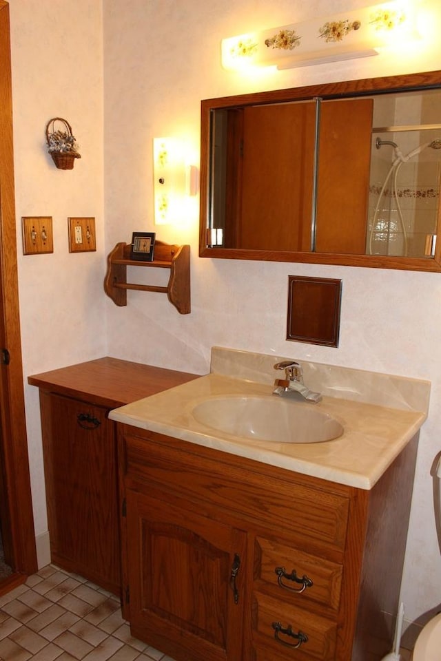 bathroom featuring vanity and a shower