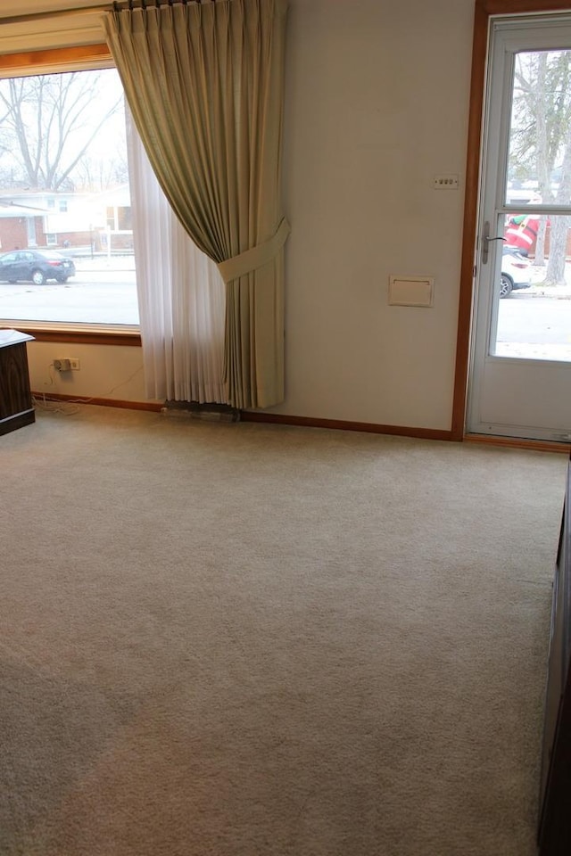 unfurnished room featuring carpet