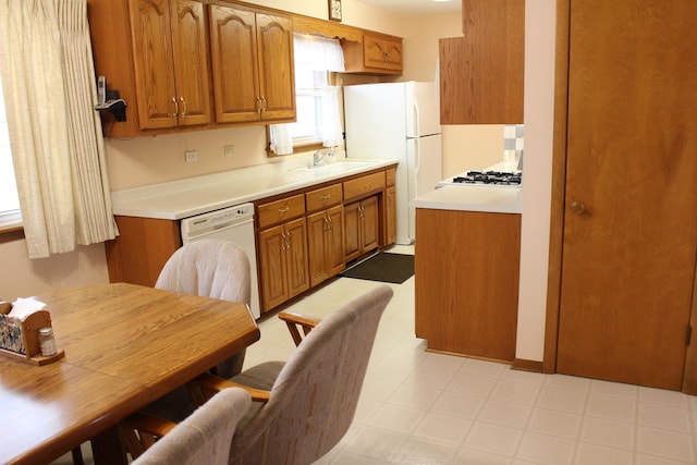 kitchen featuring sink and white appliances