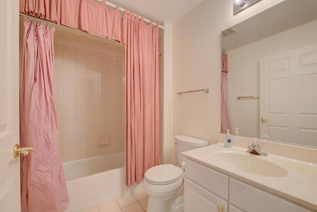 full bathroom featuring vanity, shower / tub combo, tile patterned floors, and toilet