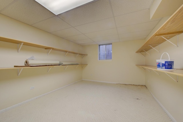 interior space with a paneled ceiling