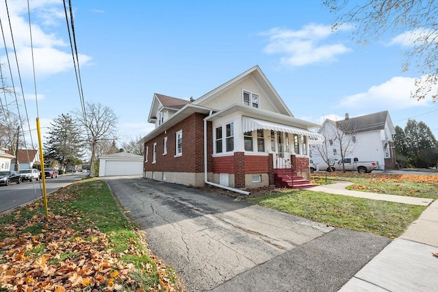 view of front of house with an outbuilding and a garage