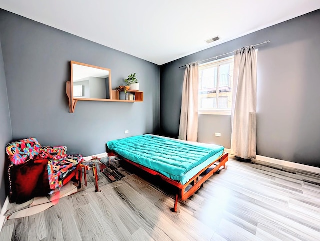 bedroom featuring light wood-type flooring