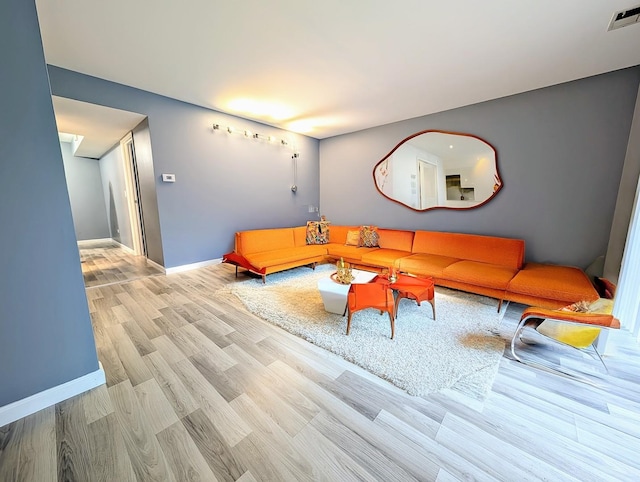 living room with light hardwood / wood-style floors