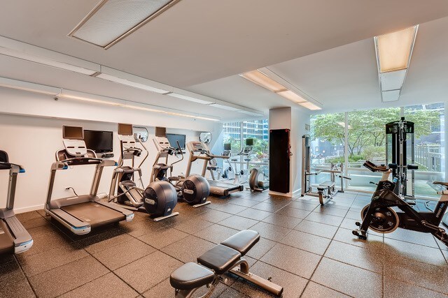 gym featuring floor to ceiling windows