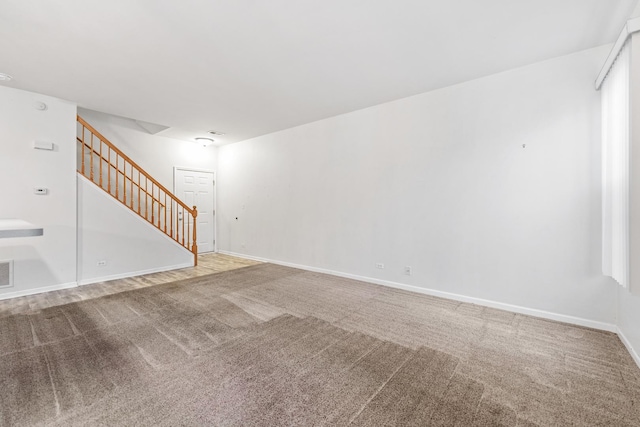 unfurnished living room with carpet