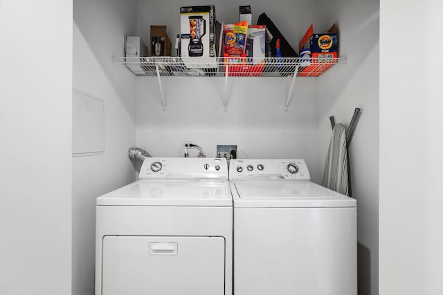 clothes washing area with independent washer and dryer