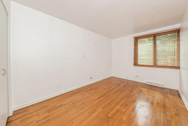 unfurnished room featuring light hardwood / wood-style floors