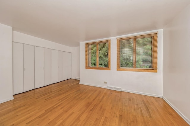 spare room featuring light hardwood / wood-style flooring
