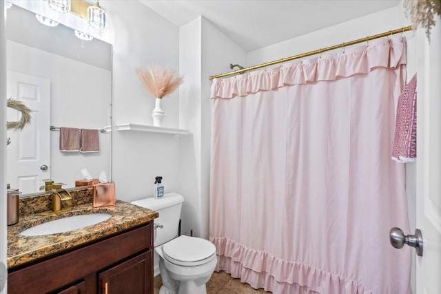 bathroom with a shower with curtain, vanity, and toilet