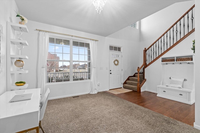 entryway with dark colored carpet