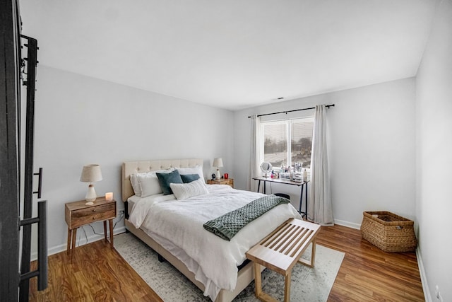 bedroom with wood-type flooring