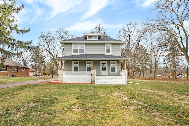 view of front facade with covered porch and a front yard