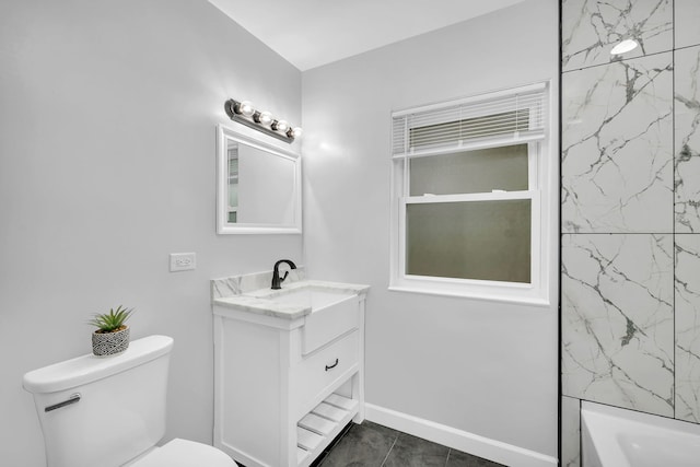 bathroom featuring tile patterned floors, vanity, and toilet