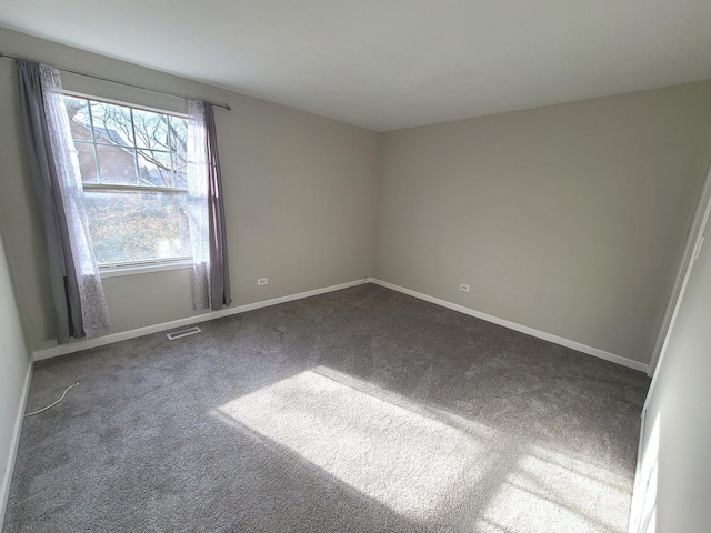 empty room with dark carpet