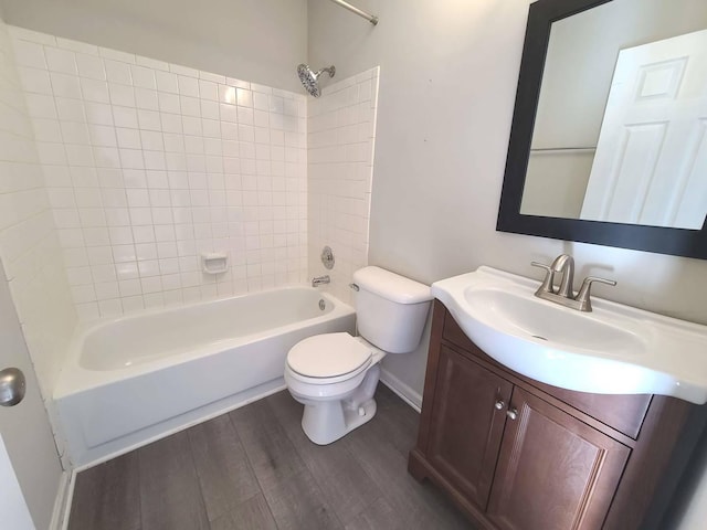 full bathroom featuring wood-type flooring, vanity, toilet, and tiled shower / bath