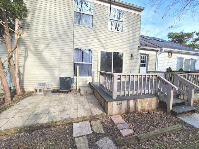 back of house featuring central AC and a patio area