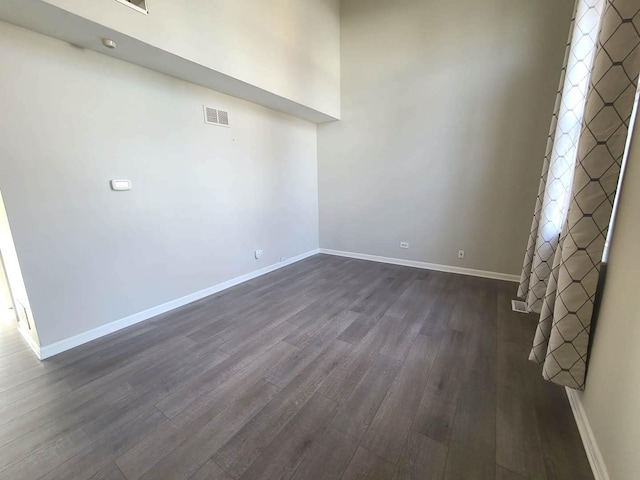 empty room featuring dark hardwood / wood-style floors