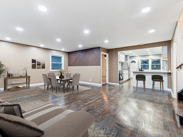 dining area featuring dark hardwood / wood-style floors