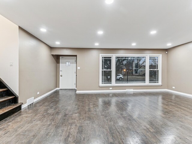 kitchen featuring dark hardwood / wood-style floors, stainless steel appliances, white cabinets, and sink