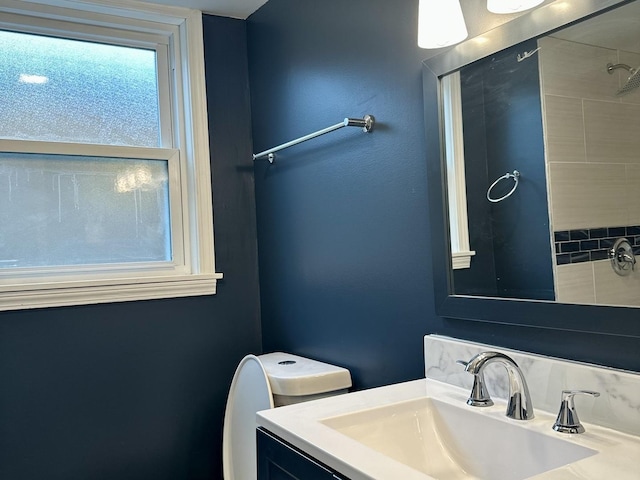 bathroom featuring toilet and vanity