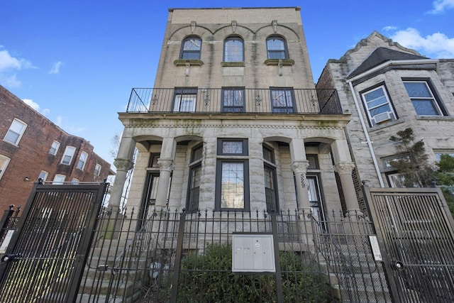 view of front of property with a balcony