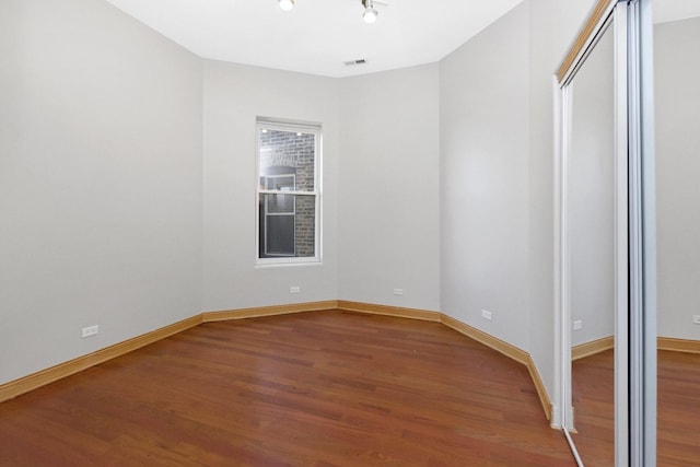 unfurnished bedroom with wood-type flooring