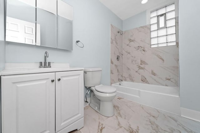 full bathroom featuring vanity, toilet, and tiled shower / bath