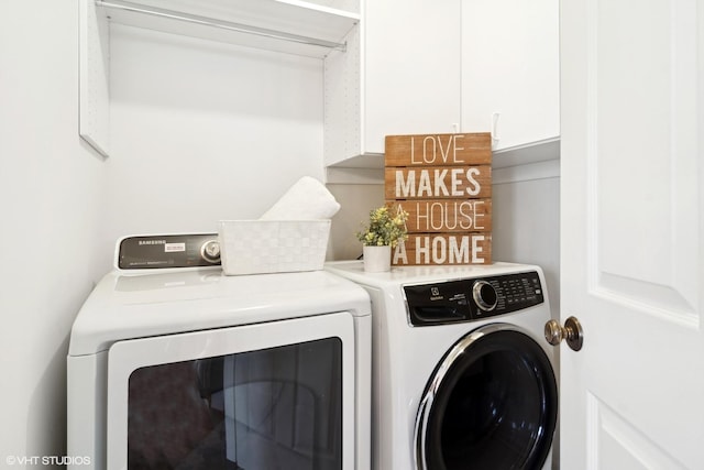 washroom featuring washing machine and dryer