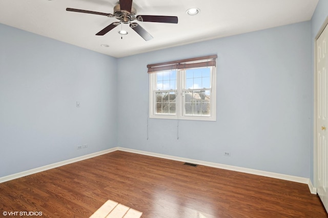 empty room featuring ceiling fan and hardwood / wood-style floors