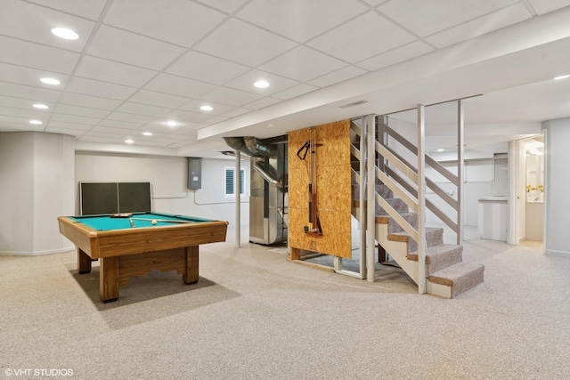 recreation room featuring light colored carpet, a drop ceiling, electric panel, and billiards