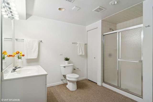 bathroom with walk in shower, vanity, and toilet