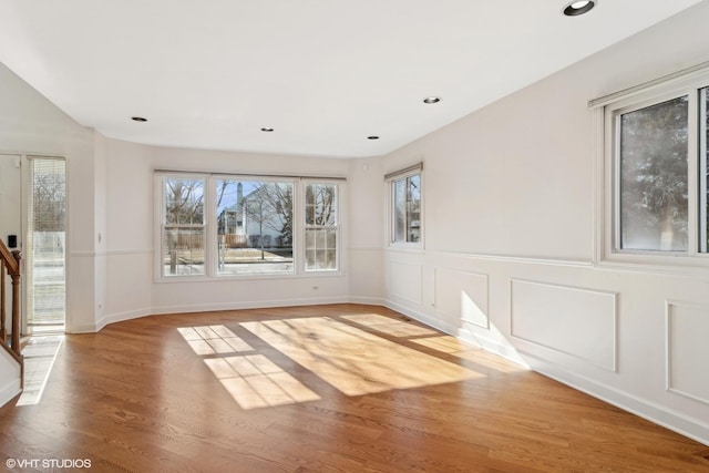 unfurnished room with hardwood / wood-style flooring