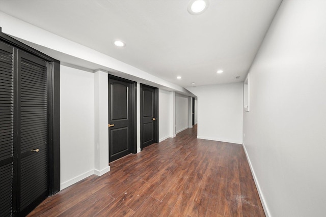 interior space featuring dark wood-style floors, recessed lighting, and baseboards