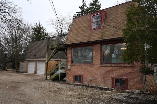 view of side of property with a garage