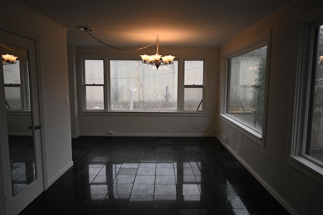 unfurnished dining area with a notable chandelier